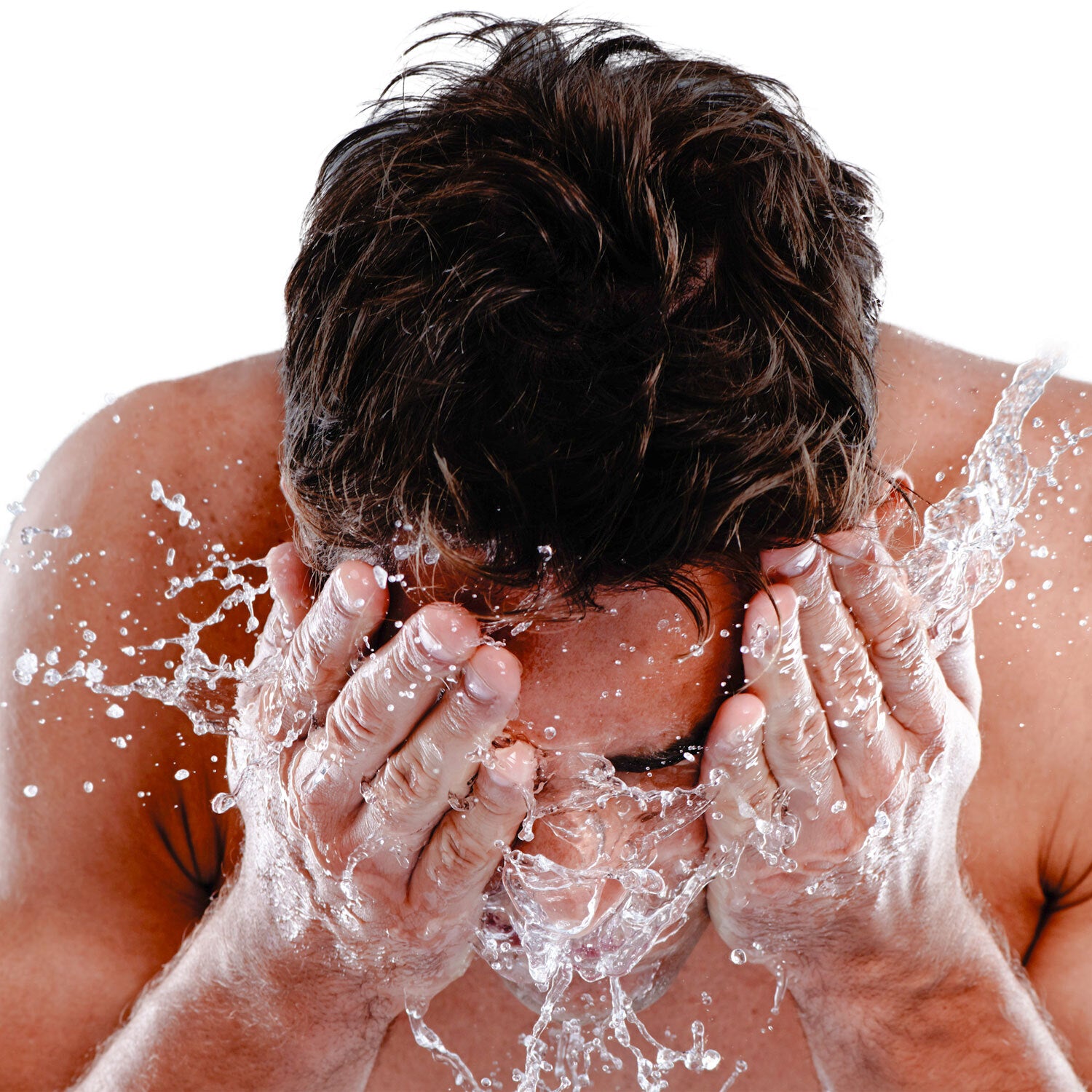 Close-up image of a man washing his face before using DermTech products, emphasizing the importance of preparation for effective skincare and hair growth routines.