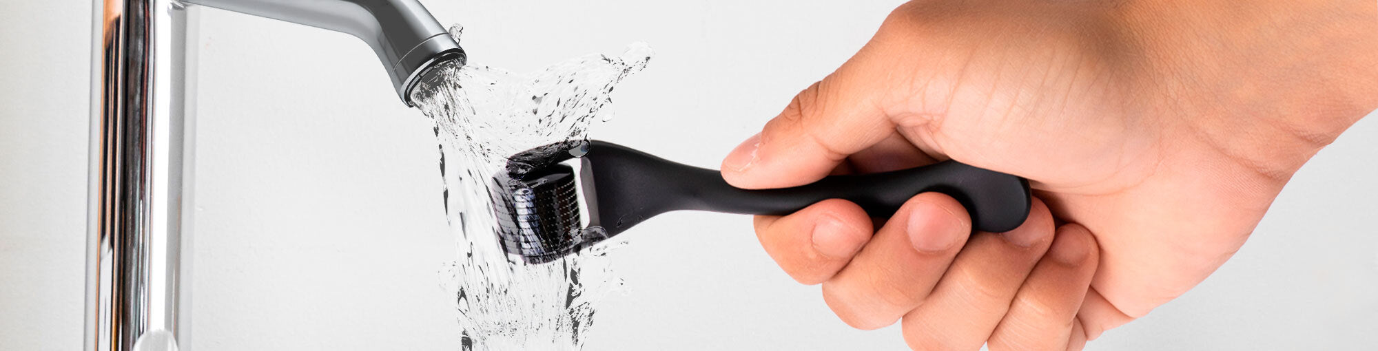 Image of a DermTech Derma Roller being washed with water, highlighting proper cleaning and maintenance for optimal performance and hygiene in hair and skincare routines.