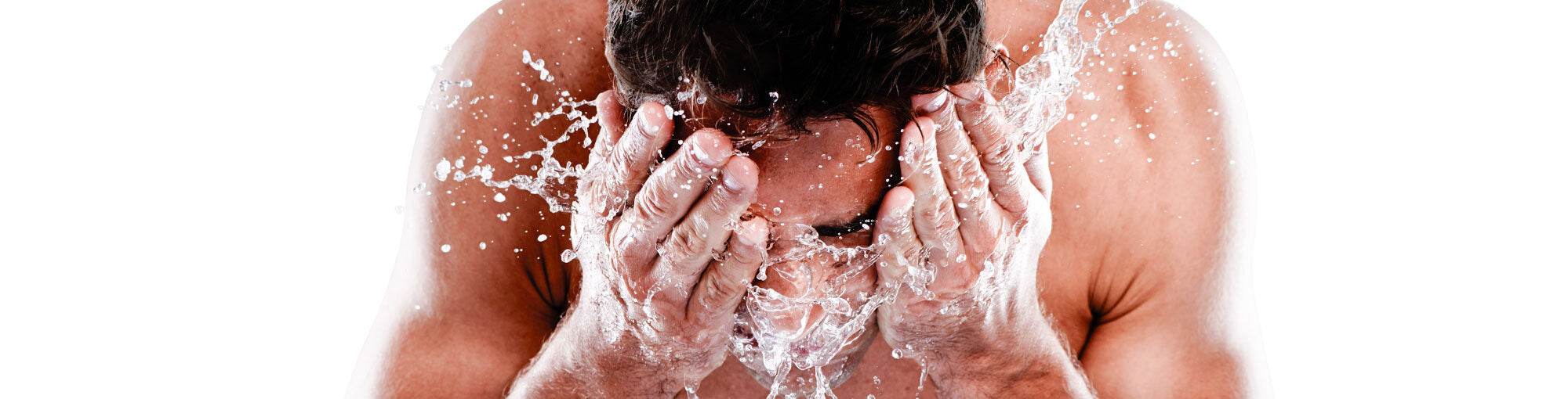 Image of a man washing his face as the first step before using a Derma Roller, highlighting the importance of preparation for effective hair and skin care with DermTech products.